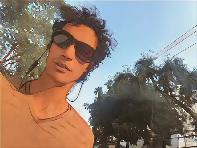 Amyn, the author of 100 Hostels, wearing sunglasses outdoors